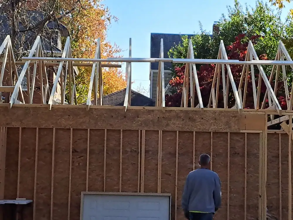 New roof trusses and wall framing on a home addition