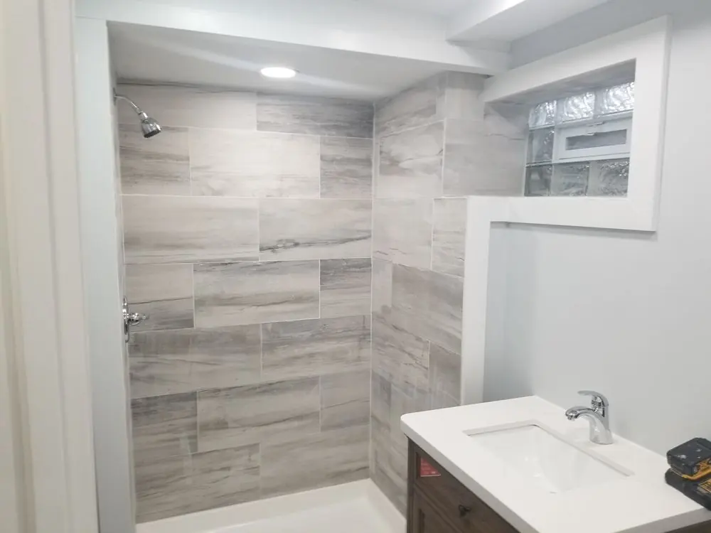Finished bathroom remodel with tiled walk-in shower