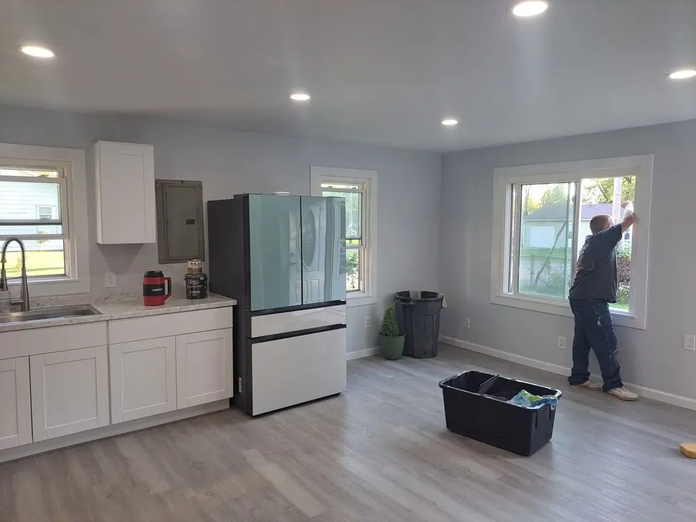 Kitchen remodel in progress with new cabinets, flooring and fresh paint on the walls